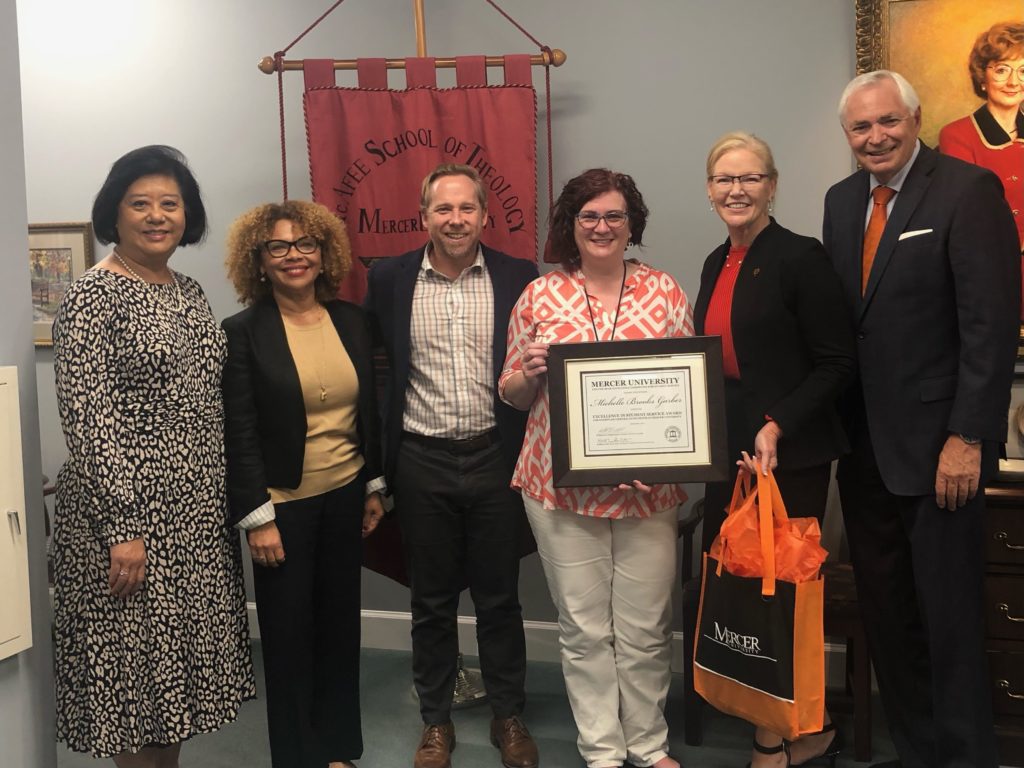 Dr. Michelle Garber (fourth from left) is pictured with Bear Excellence Committee members Sharon Lim, Brenda Austrie-Cannaday and Nathan Cost; Dr. Penny Elkins, senior vice president for enrollment management; and Mercer President William Underwood. 