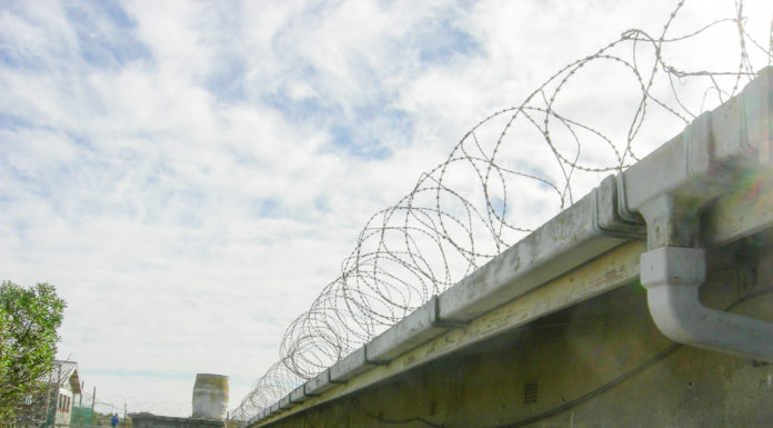 In these tough times, we must become prisoners of hope Barbed wire surrounds an old prison