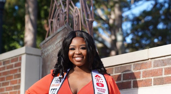 Graduate Spotlight: Sheridan King A woman in an orange dress