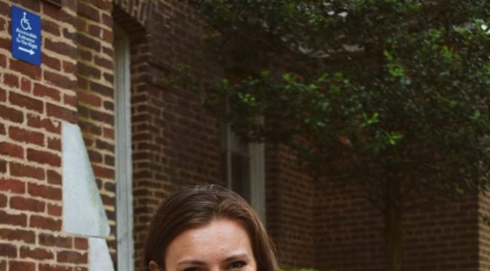 Graduate Spotlight: Carlin Weinberg A young woman wears graduation regalia around her neck