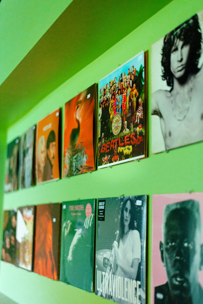Records hung on the wall inside Vertigo Vinyl