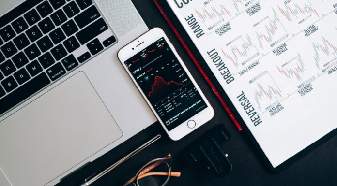 Why is the stock market falling? A Mercer finance expert explains and offers advice A smart photo screen shows a drop in stocks