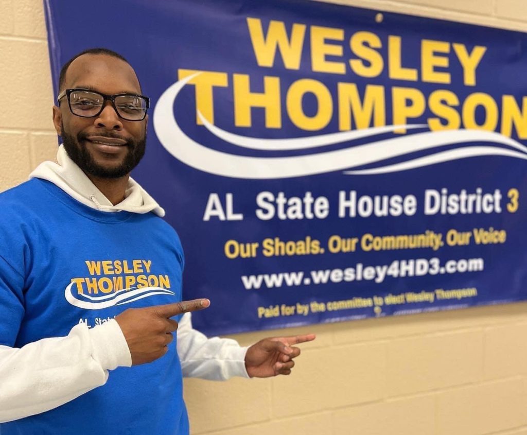Wesley Thompson with campaign sign.