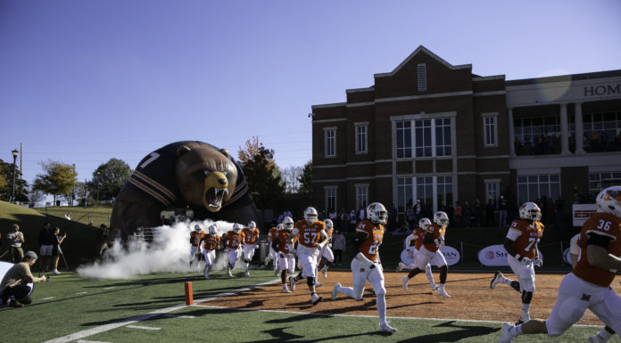 Fan Appreciation Day to jump-start exciting fall sports lineup | Voice of the Bears football players run out from the tunnel