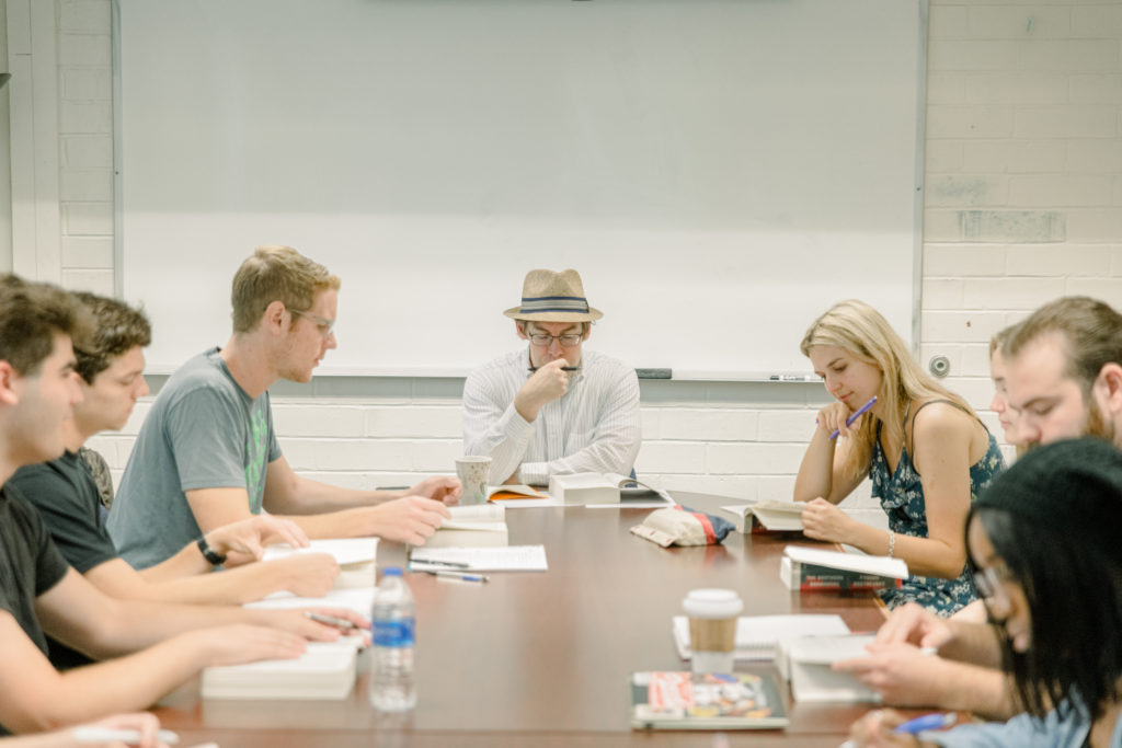 Dr. Kevin Honeycutt  lead students in discussion during his Great Books class on Aug. 25. 