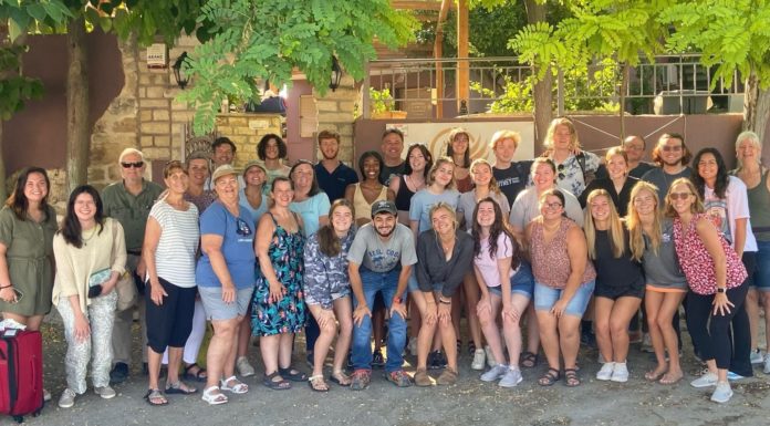 Greece study abroad program teaches students about art, culture and the human condition The Mercer group is shown behind behind Pegasus Rooms in Ancient Corinth this summer.