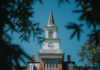 Mercer community invited to Service of Blessing for President Elkins A white clock tower with a steeple atop Willingham Hall.