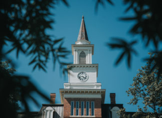 Mercer community invited to Service of Blessing for President Elkins A white clock tower with a steeple atop Willingham Hall.