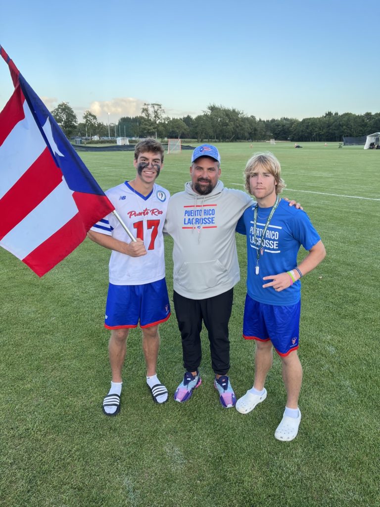 Christian Laureano (left) is pictured with Matt Cassalia, coach for team Puerto Rico, and his brother, Sean.