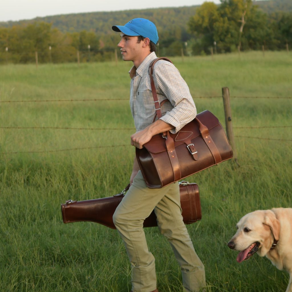 Luke Kolbie carries a Kingfisher Leatherworks weekender bag and prototype gun case.