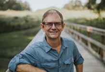 English professor chosen for inaugural Georgia Humanities Georgia Circuit Speakers Bureau Gordon Johnston stands on a boardwalk.