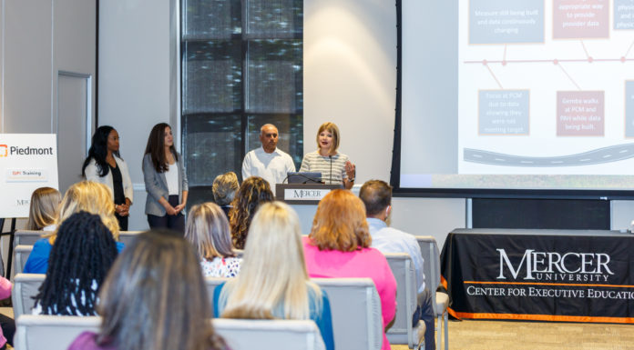 Mercer opens registration for Lean Six Sigma Yellow Belt and Green Belt Conference room with audience and presenters