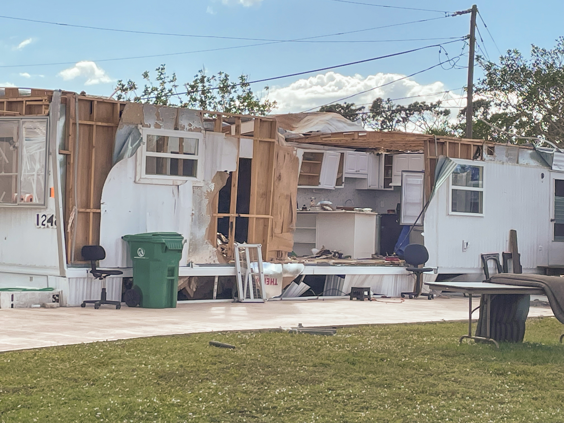 A modular home with the front torn off.