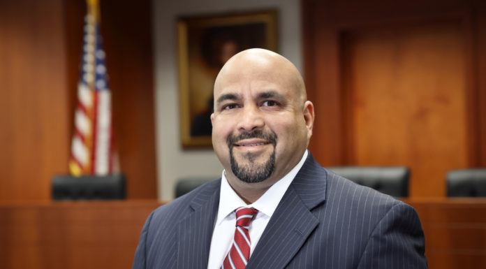 Mercer Law School launches new bankruptcy program headshot of Ishaq Kundawala standing in a courtroom