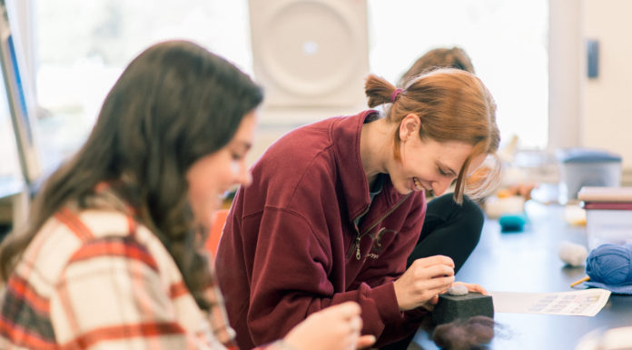 Students learn to knit, crochet while examining intersection of gender and fiber arts Students work on needle felt animals.