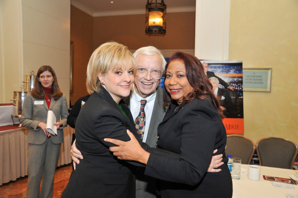 Nancy Grace, Robert Steed and Yvette Miller embrace.