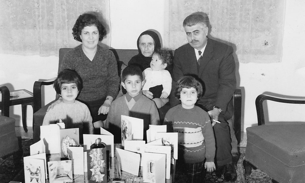 Dr. Hani Khoury (being held in center) as a child with his family in Palestine.
