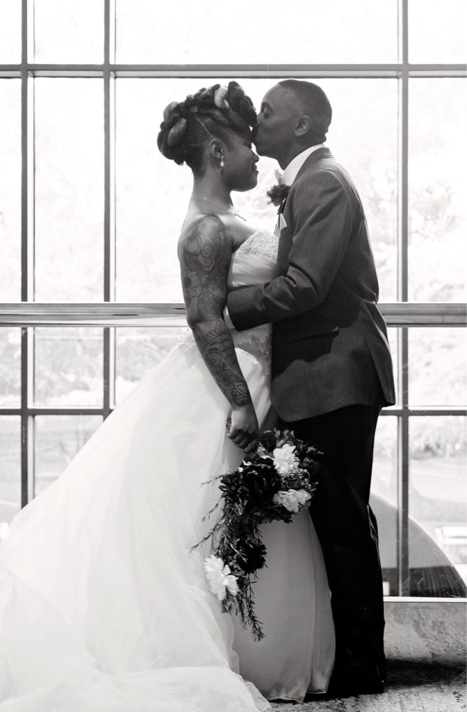 Kia and Daniel Pascal on their wedding day in 2014.