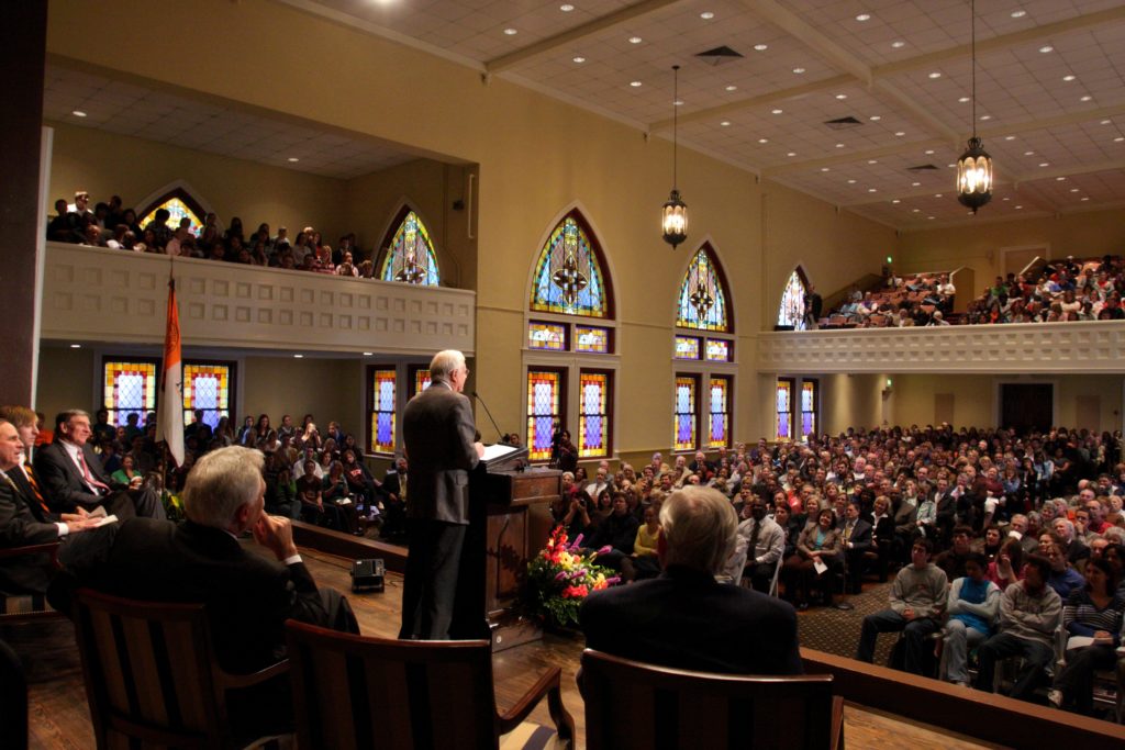 Shot from behind Jimmy Carter as he speaks to a group at Mercer.