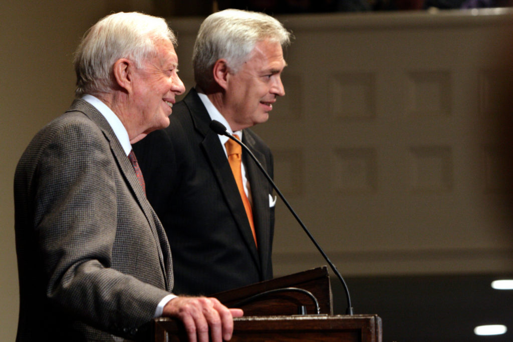 Jimmy carter and William D. Underwood standing at a podium.