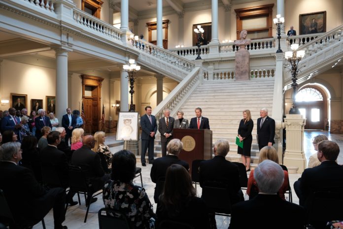 gov kemp speaks to an audience at the georgia capitol