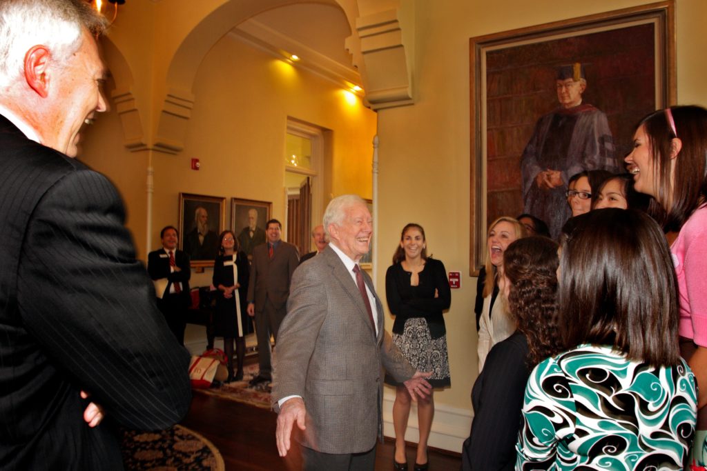 Jimmy Carter warmly greets a group of Mercer students.