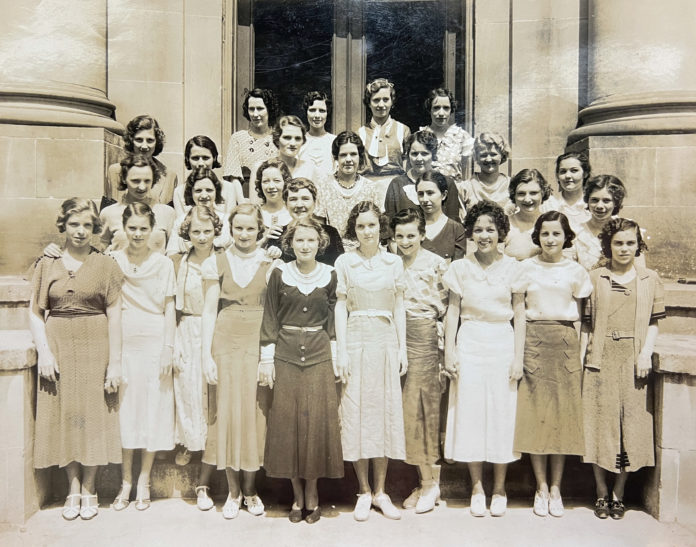 Sallie Boone is seen with a group of female students in front of what is now Hardman Hall.