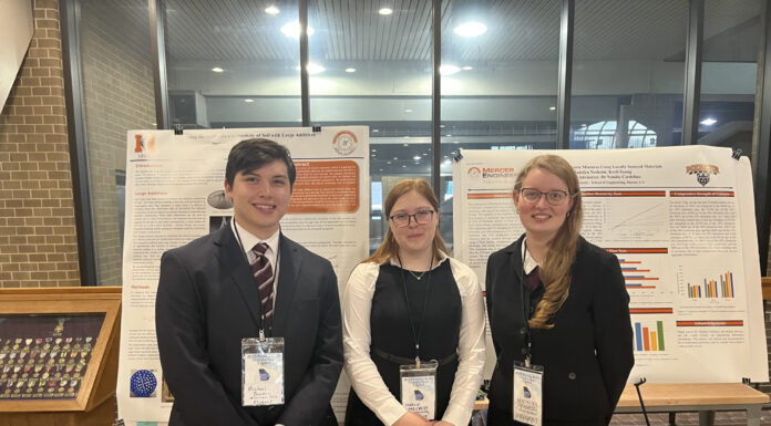Mercer University students present at 2023 ‘Posters at the Capitol’ event three students stand in front of two posters