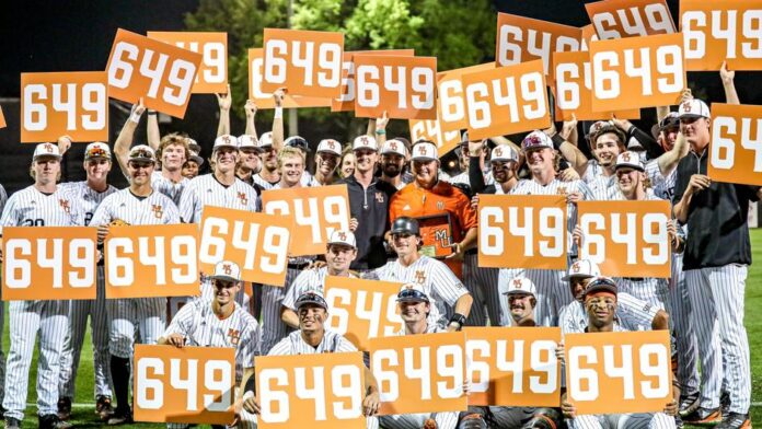 baseball players hold multiple signs that say 649