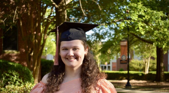 Graduate Spotlight: Emma Plack headshot of emma plack wearing a graduation cap