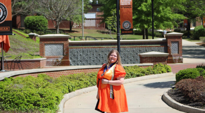 Graduate Spotlight: Abigail Durant abigail durant wears an orange dress on the macon campus