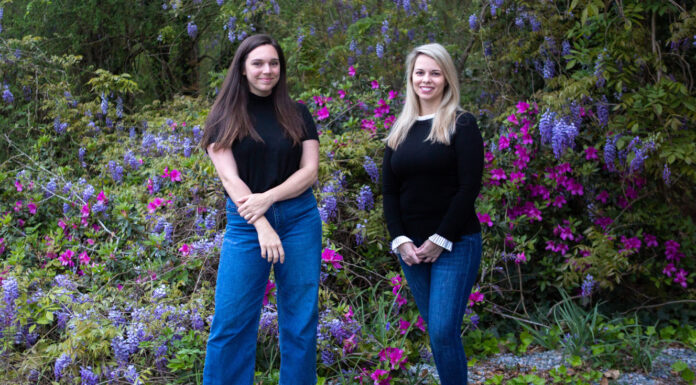 Mercer professor creates a true-crime splash with ‘Prison Town’ podcast two women stand in front of a flowering bush