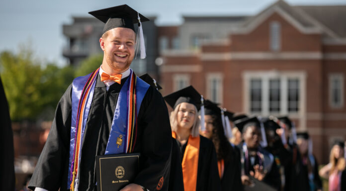 Mercer to confer degrees to more than 2,600 graduates at four commencements in May grad holds diploma