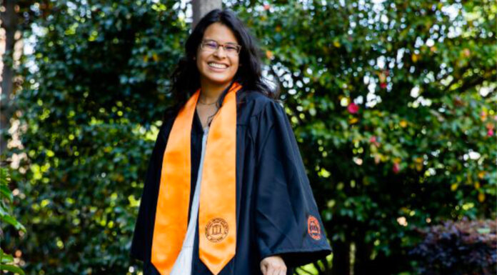 Graduate Spotlight: Sara Davila Severiano Sara Davila Severiano wears her graduation gown and orange stole