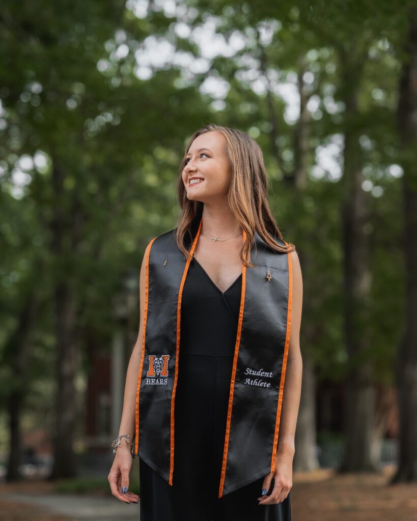 Marina Van Sickle wears her graduation stole for a photo.