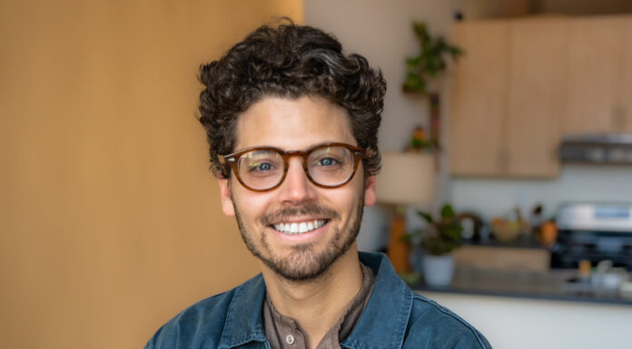 New McEachern Art Center director found passion for art while growing up in Macon portrait of johnny cohen with his arms crossed