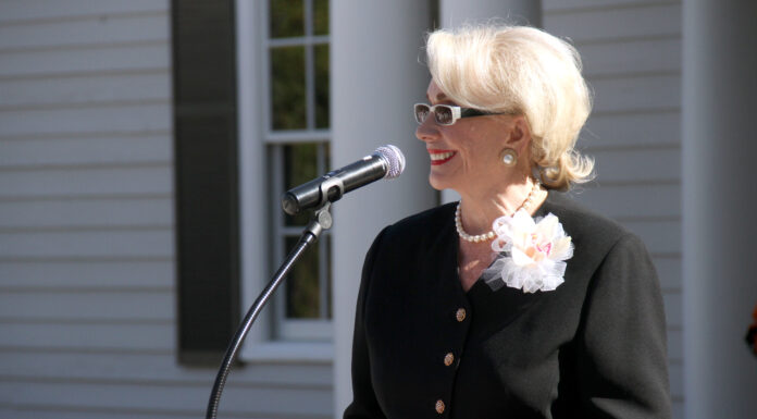 Emily Myers served Mercer ‘with intelligence, dignity and integrity’ | Mercer Legends A woman speaks at a podium.