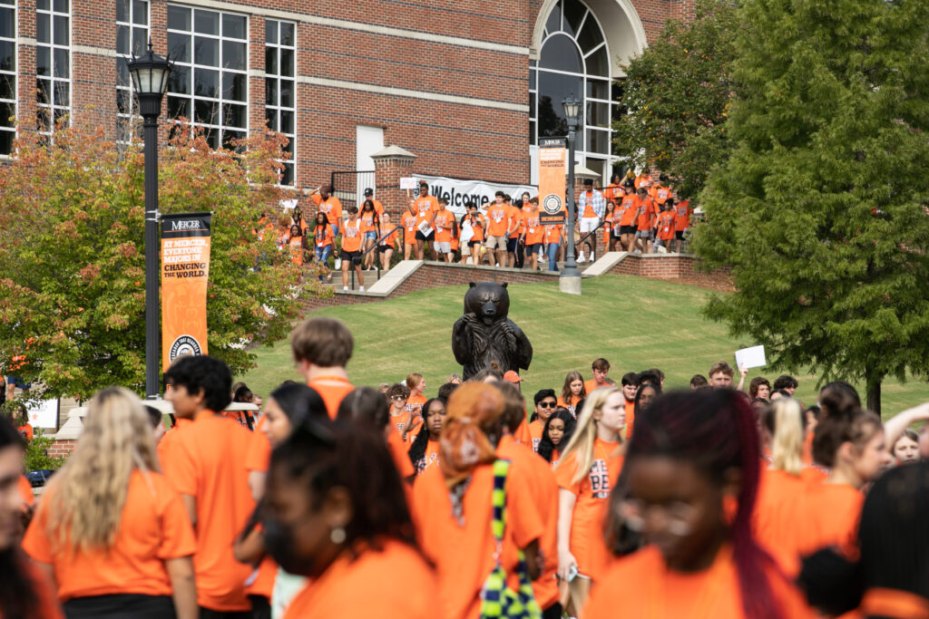 hundreds of students in orange shirts on the macon campus