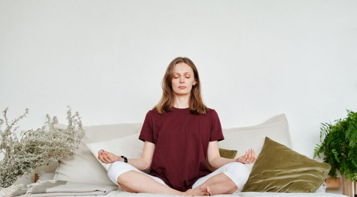 Meditation may reduce risk of diabetes complications, Mercer study finds Woman in Red Shirt Sitting on Couch Meditating