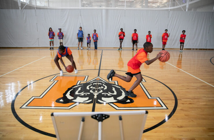 kids race to shoot basketballs