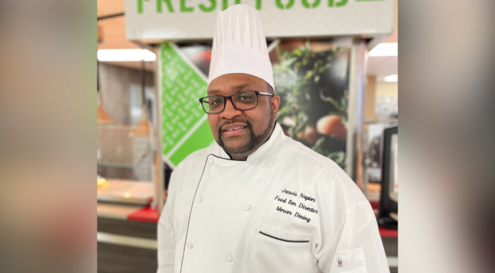 Mercer chef strives to improve students’ dining experiences Jarvis Napier wears a chef's uniform and hat.