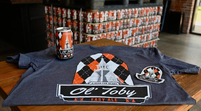 Fall Line debuts Ol’ Toby Easy Ale, official beer of Mercer Athletics ol' toby easy ale beer can sits on a branded ol' toby easy ale T-shirt