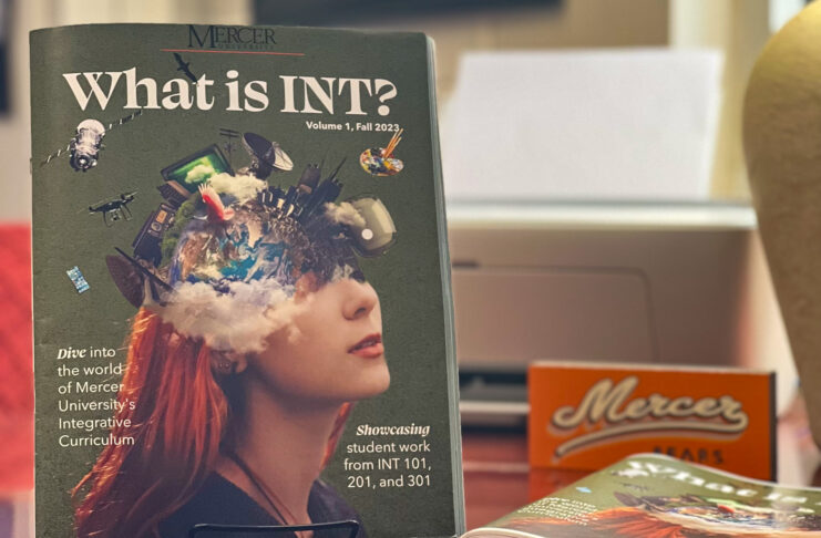 what is int? magazine is on display on a desk