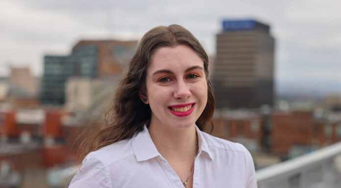 Journalism alumna honored for reporting on failures of child protective services headshot of rylee kirk against city skyline