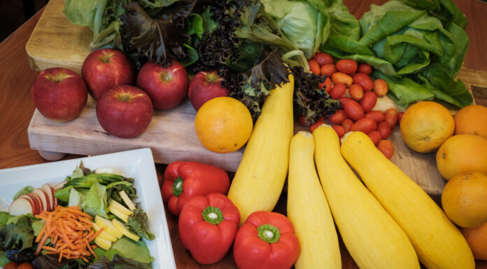 New Mercer Dining partnership brings food from farm to table an array of fresh produce including lettuce, apples, red bell peppers, yellow squash, oranges and a side salad