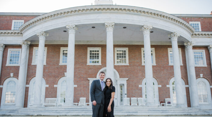 Mercer couple chosen for yearlong Georgia Supreme Court clerkship A couple stands in front of a large stately building with white columns and stairs.