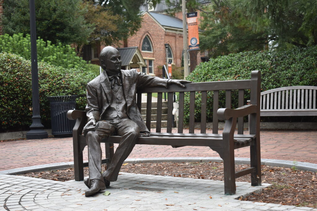 life-size statue of man (Jesse Mercer) sitting on a park bench