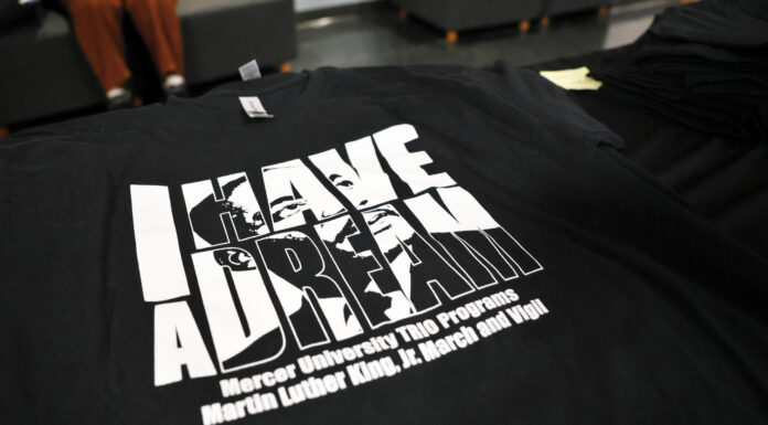 MLK wrote that all are connected. If one suffers, all are affected | Dr. Craig McMahan black t-shirt features MLK's image and the words I Have a Dream