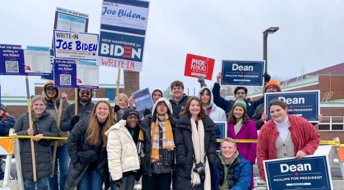 Students travel across the country to get in-person look at presidential primaries Mercer students holding political signs for Nikki Haley, Dean Phillips, and to write-in Biden.