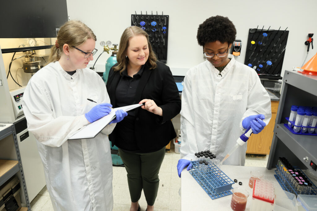 female professor and two female students working in lab